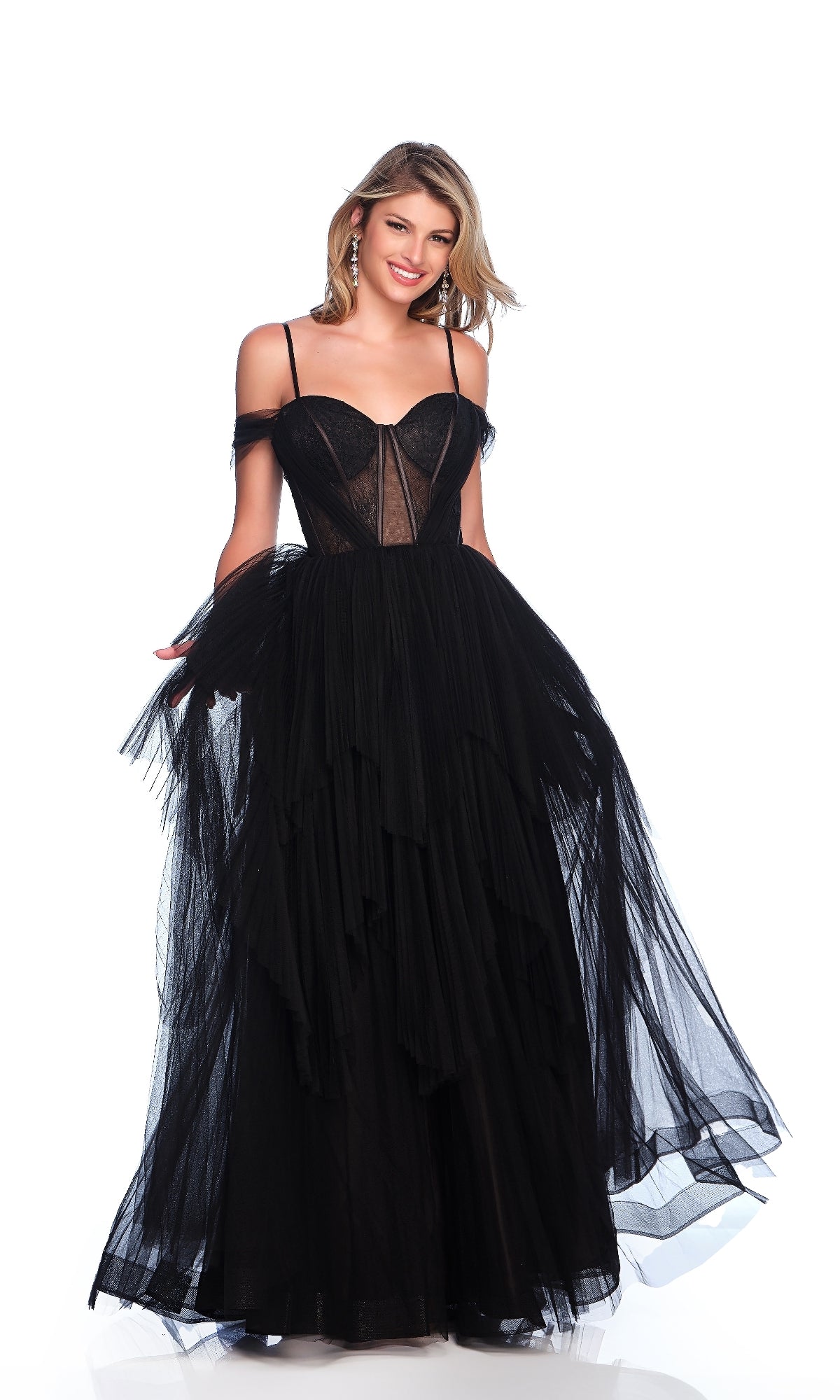 A woman poses against a white background wearing the Sheer-Corset Prom Ball Gown: Dave & Johnny 11854—a black, off-the-shoulder tulle dress with a sheer corset bodice, thin straps, elegant sheer details, and a layered A-line skirt.